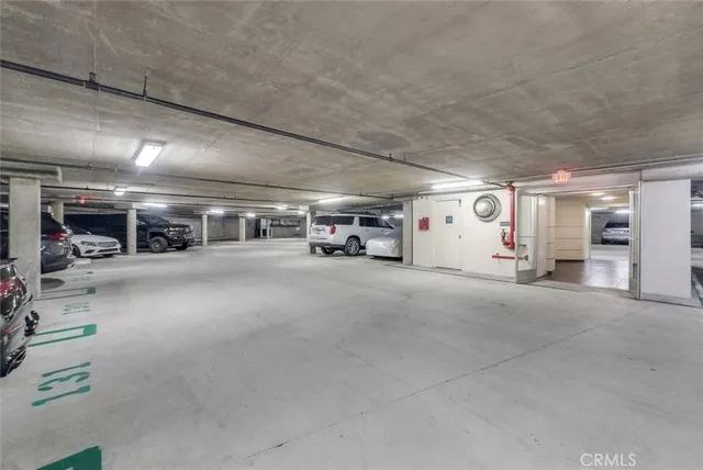 a view of parking garage with cars