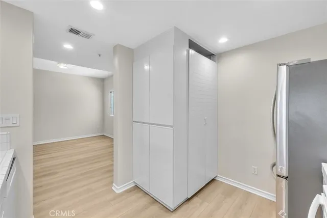 a view of hallway with wooden floor