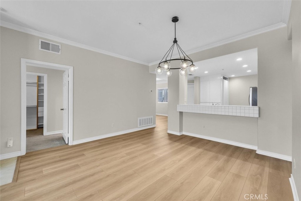 2243 Martin Irvine, CA 92612 - Photo 9 of 36 a view of a big room with wooden floor and windows