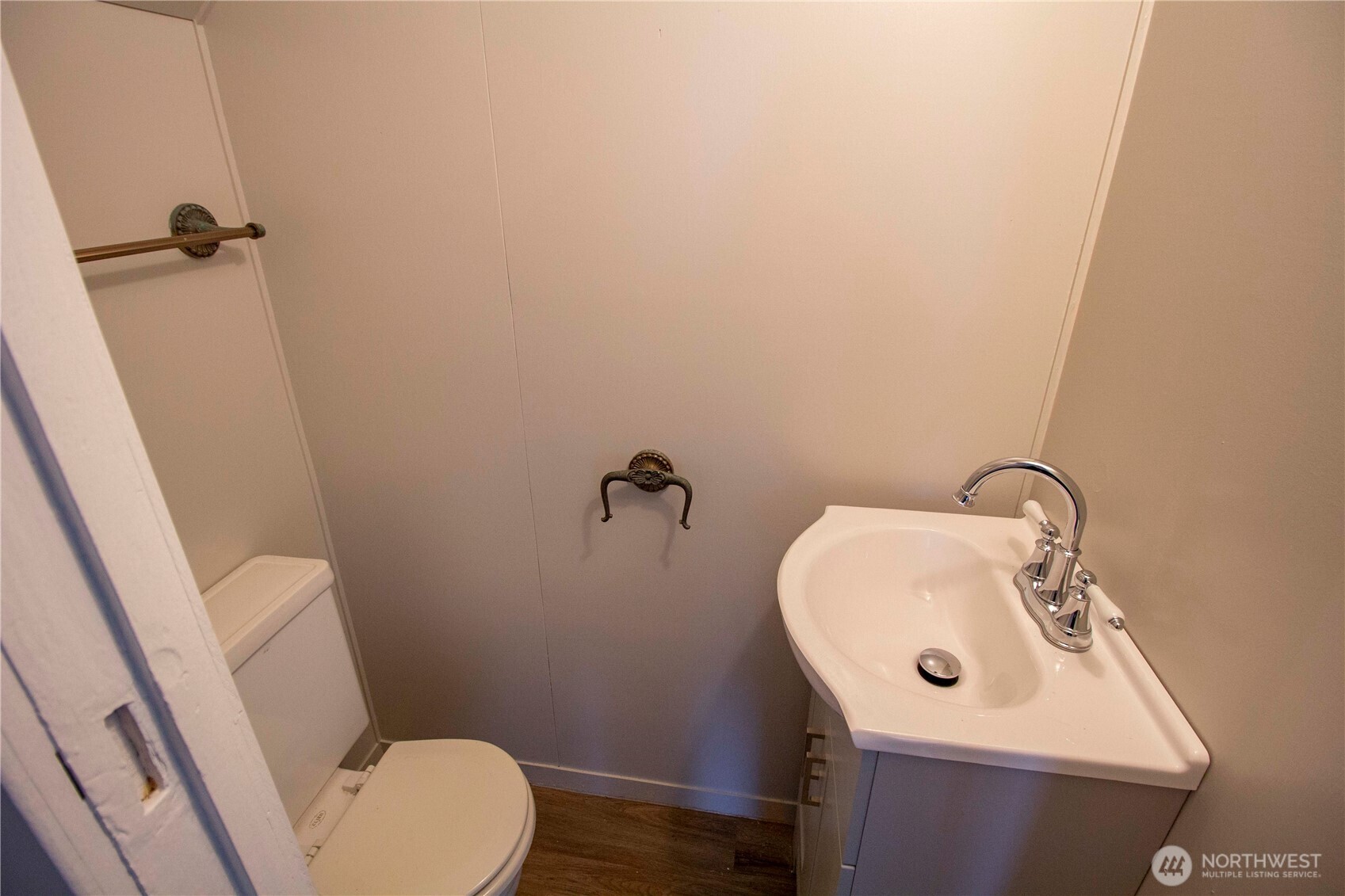 412 5th Street Hoquiam, WA 98550 - Photo 14 of 17 a bathroom with a sink a toilet and a mirror