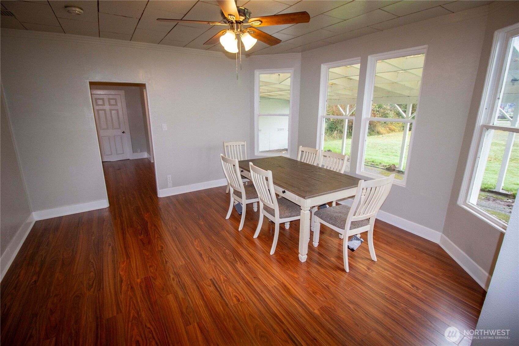412 5th Street Hoquiam, WA 98550 - Photo 4 of 17 a view of a dining room with furniture window and wooden floor