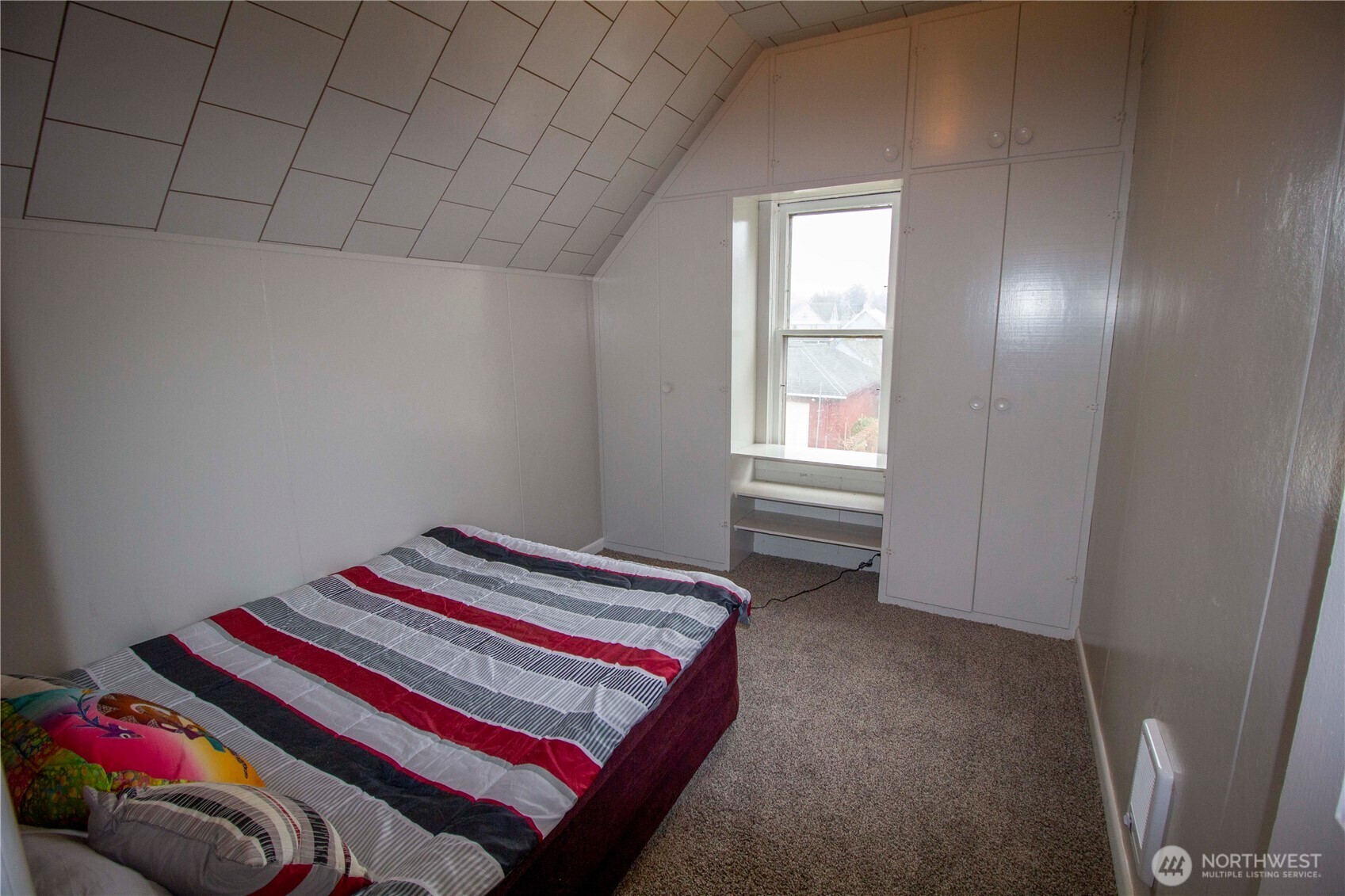 412 5th Street Hoquiam, WA 98550 - Photo 10 of 17 a room with a bed and a window