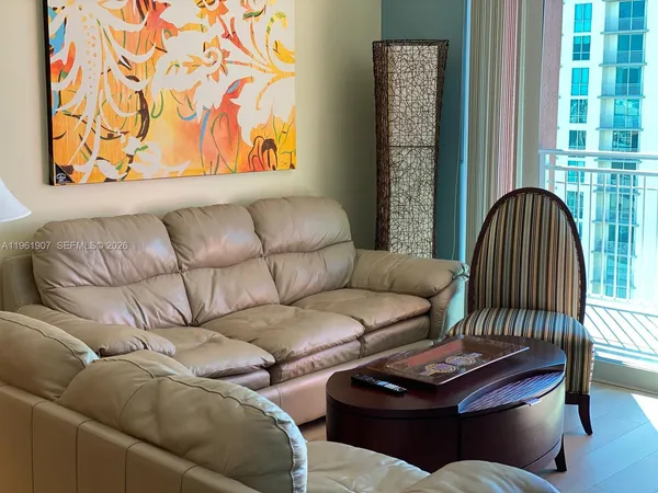 a living room with furniture and a window