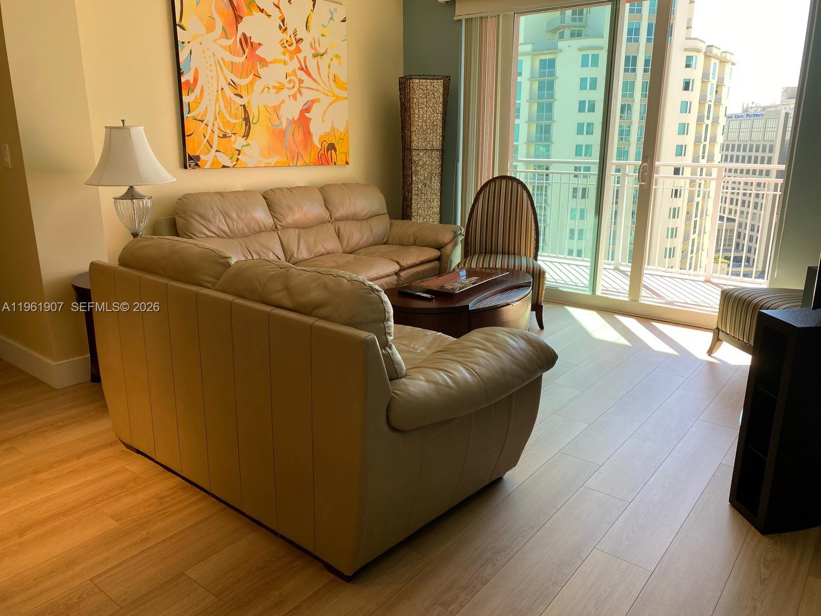 7350 Southwest 89th Street, Unit 2104S Miami, FL 33156 - Photo 12 of 30 a living room with furniture and a window