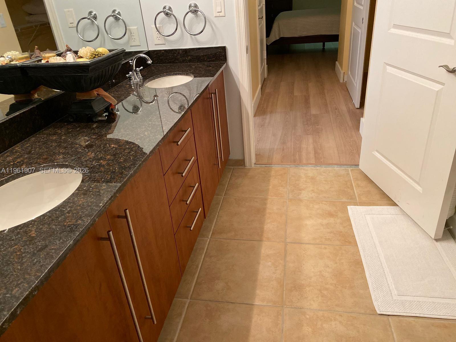 7350 Southwest 89th Street, Unit 2104S Miami, FL 33156 - Photo 19 of 30 a bathroom with a sink a toilet and a shower