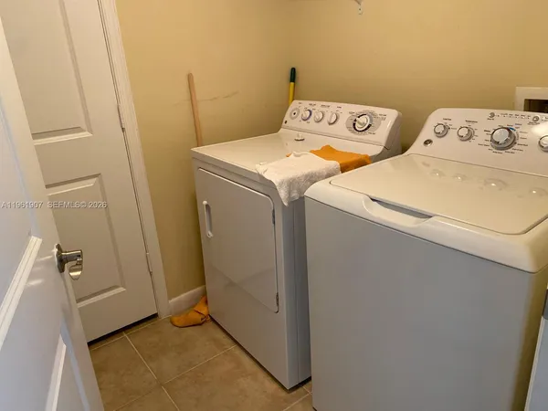 a utility room with dryer and washer
