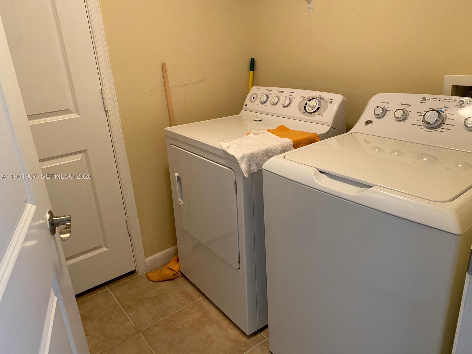 7350 Southwest 89th Street, Unit 2104S Miami, FL 33156 - Photo 22 of 30 a utility room with dryer and washer