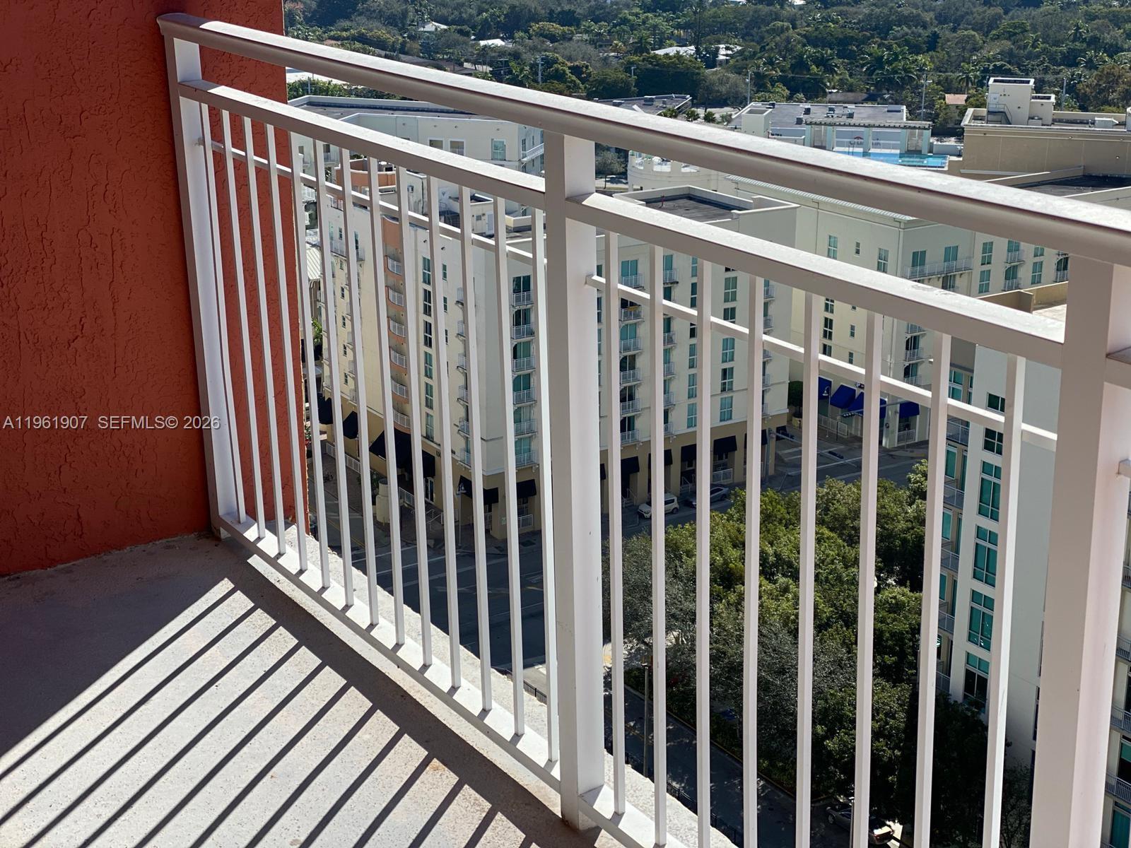 7350 Southwest 89th Street, Unit 2104S Miami, FL 33156 - Photo 26 of 30 a view of a balcony with wooden floor