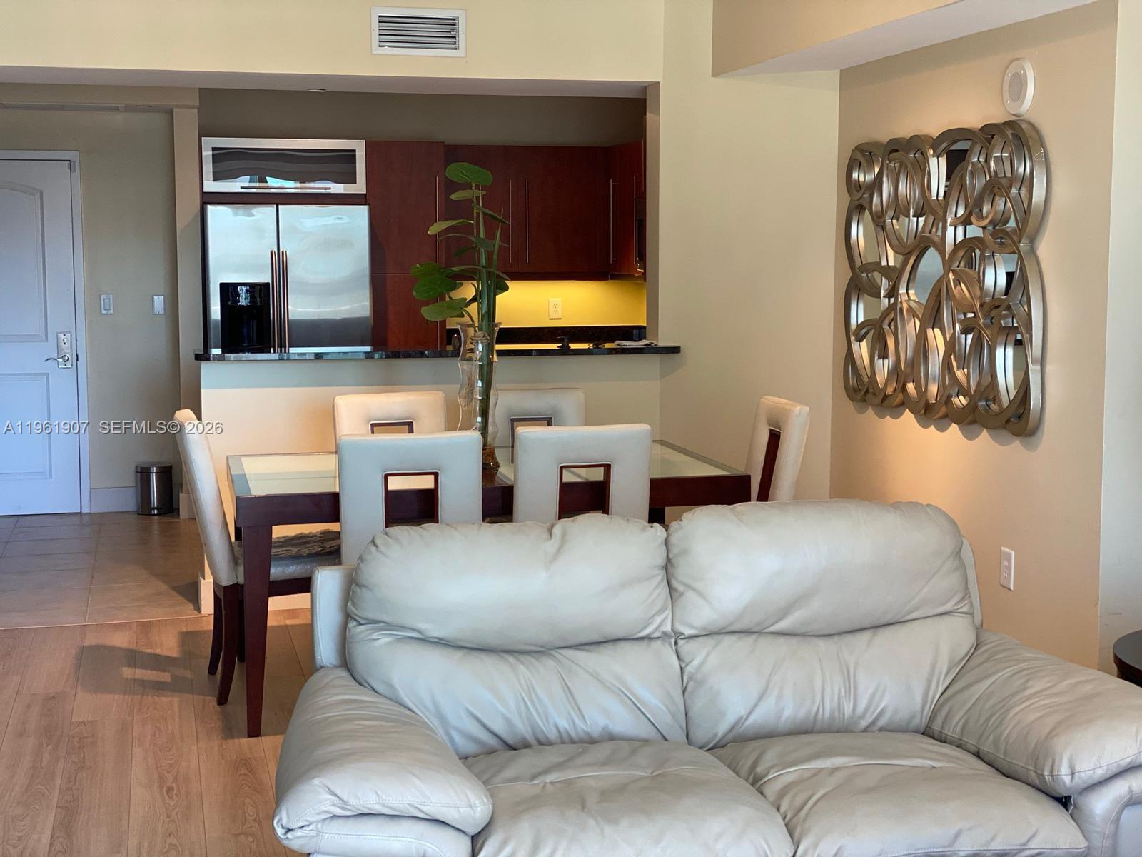 7350 Southwest 89th Street, Unit 2104S Miami, FL 33156 - Photo 6 of 30 a living room with furniture and a flat screen tv