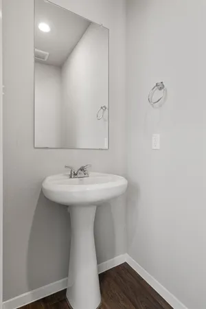 a bathroom with a sink and mirror