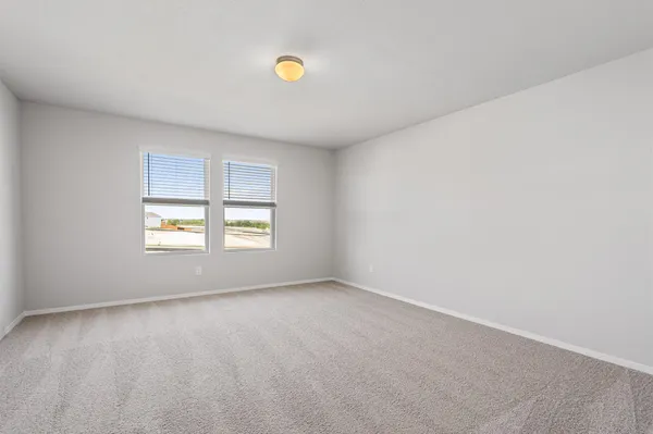 an empty room with closet area