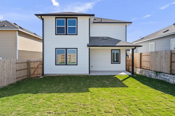 a house that has a big yard in front of it