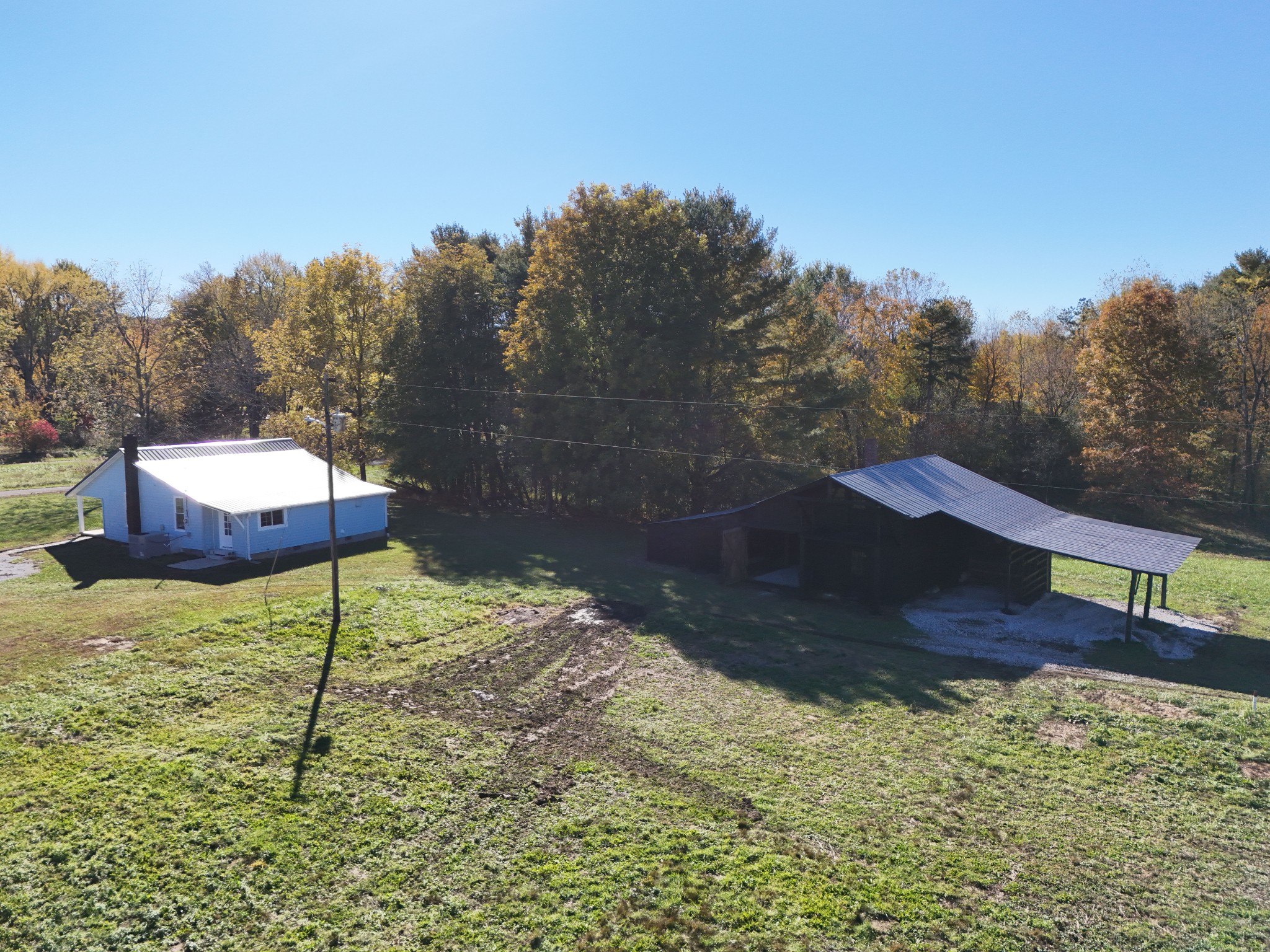 65 Duck Pond Road Palmer, TN 37365 - Photo 23 of 25 a backyard of a house with a yard and outdoor seating