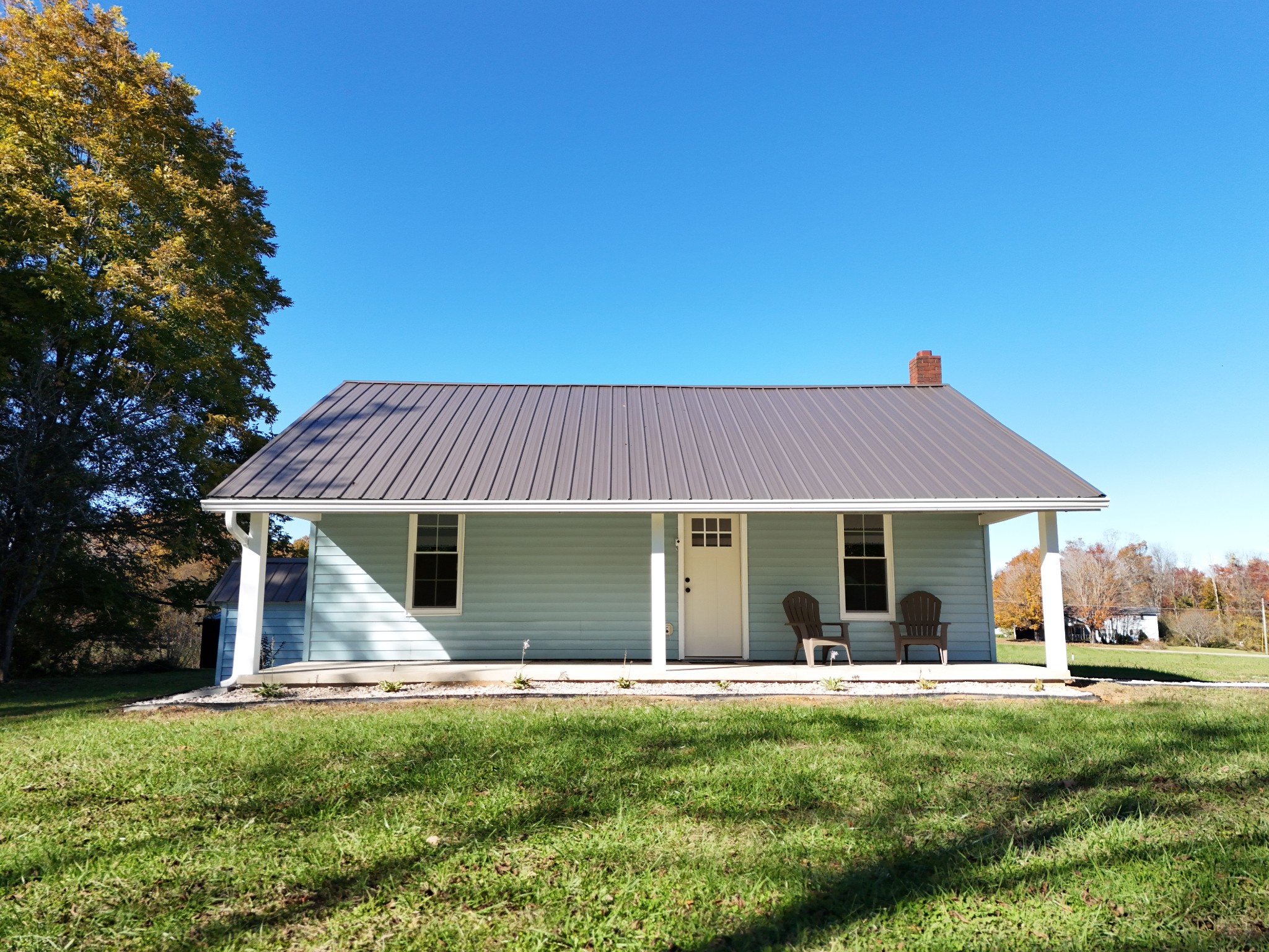 65 Duck Pond Road Palmer, TN 37365 - Photo 25 of 25 a view of a house with a yard potted plants and large tree