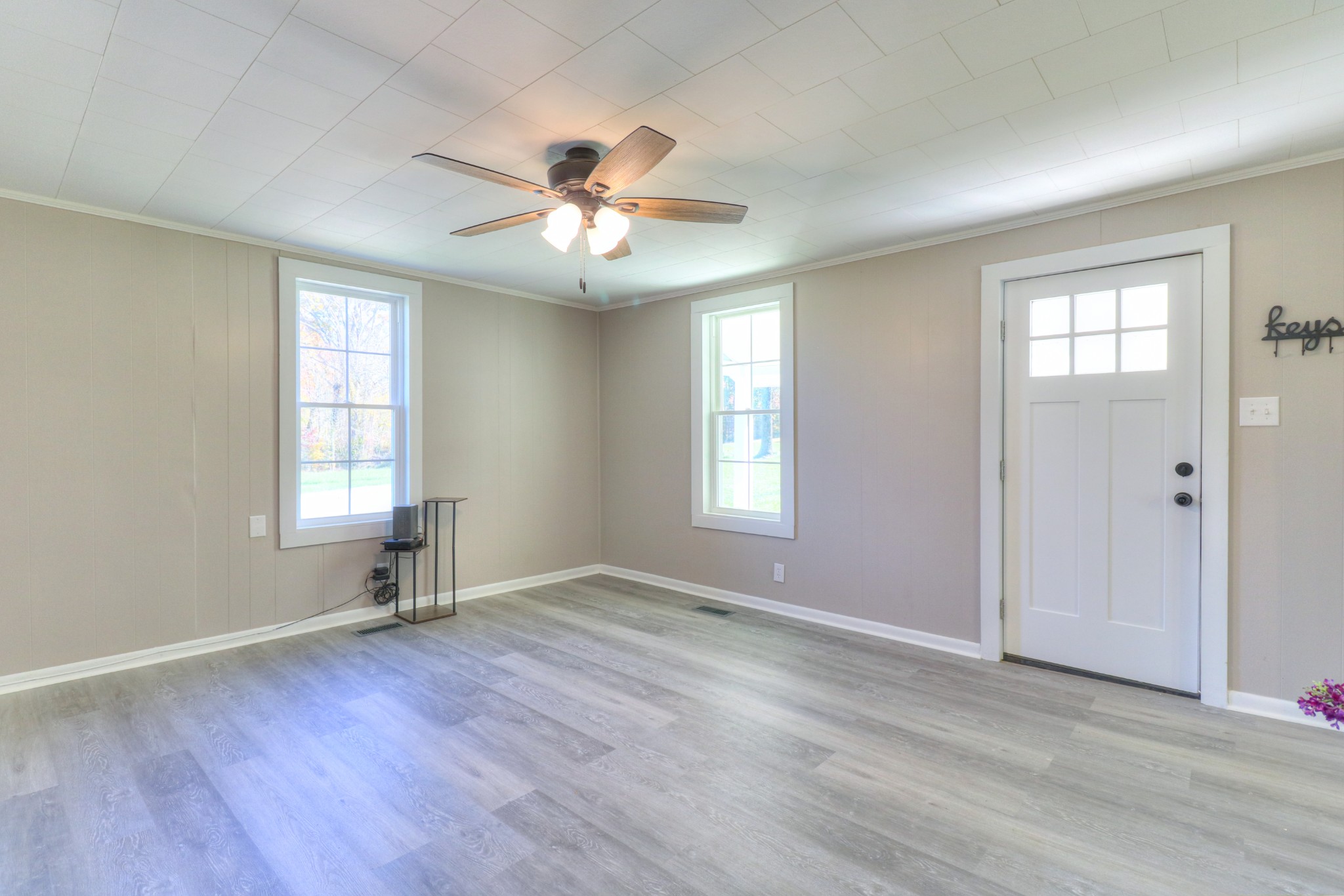 65 Duck Pond Road Palmer, TN 37365 - Photo 6 of 25 a view of an empty room with a window and wooden floor