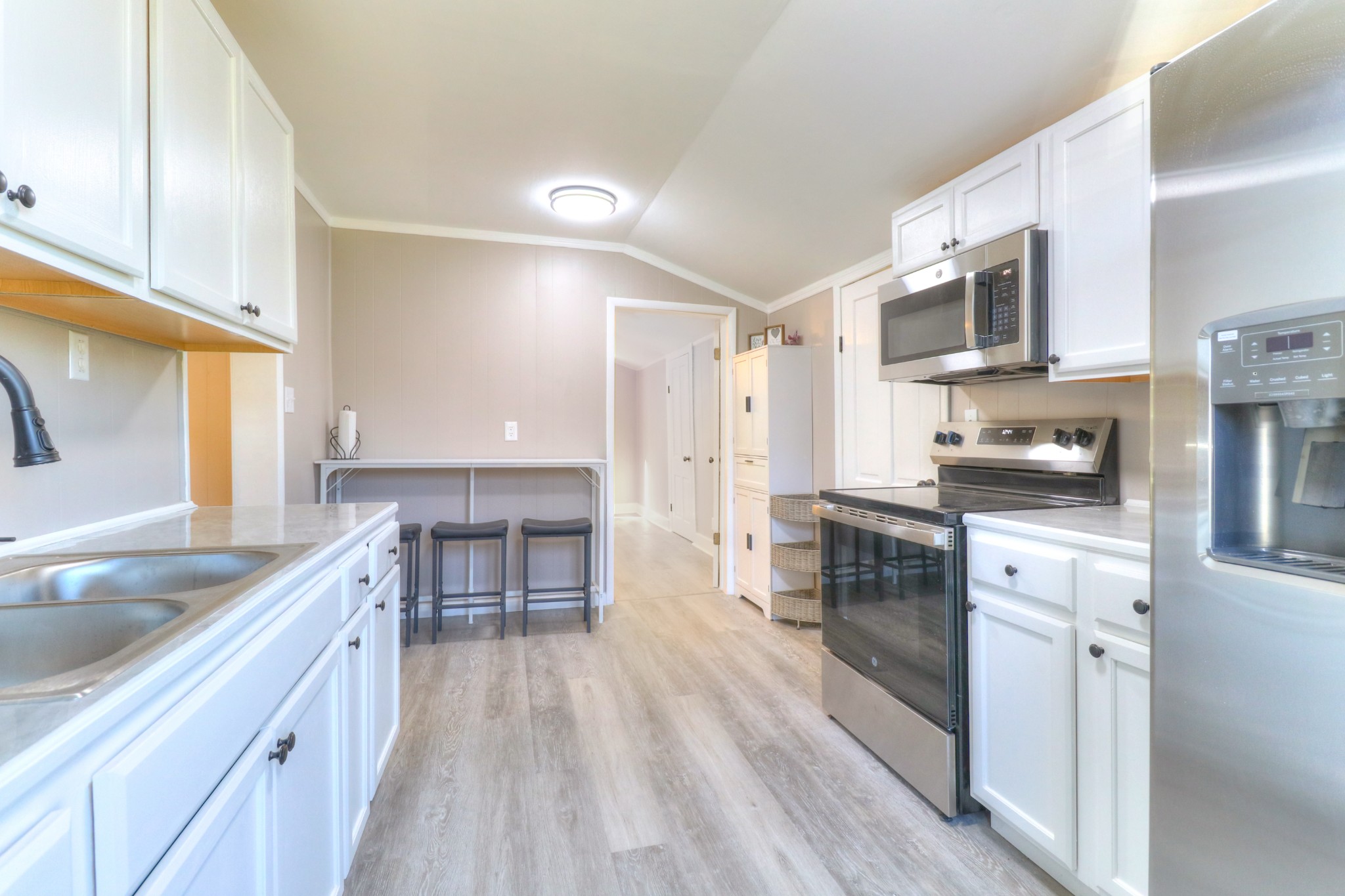 65 Duck Pond Road Palmer, TN 37365 - Photo 8 of 25 a kitchen with stainless steel appliances granite countertop a sink stove and refrigerator
