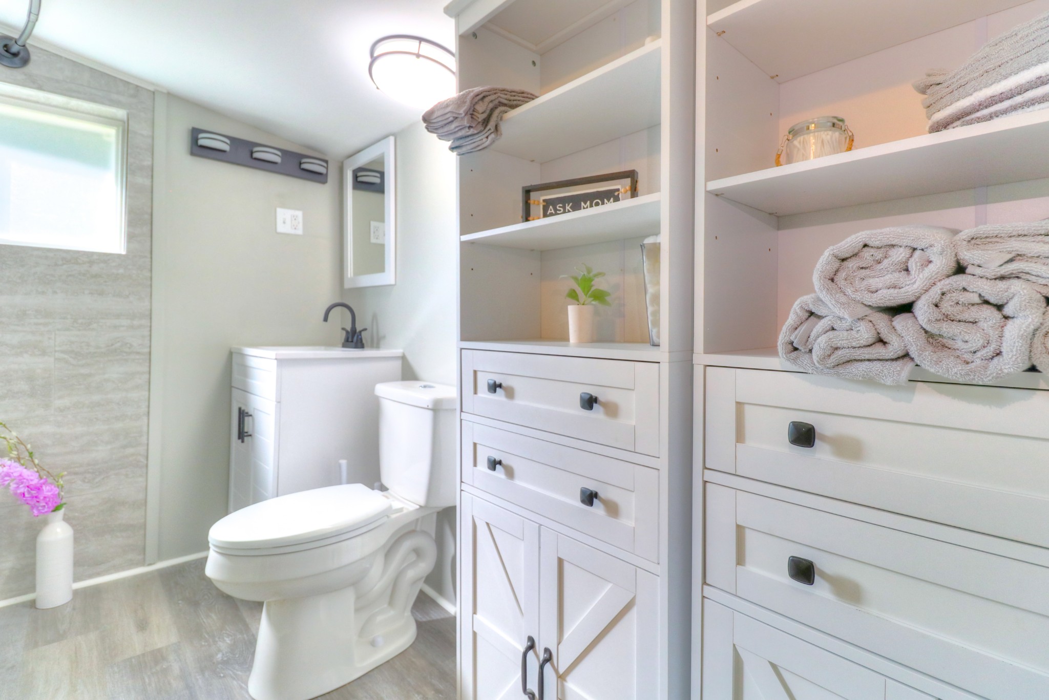 65 Duck Pond Road Palmer, TN 37365 - Photo 10 of 25 a bathroom with a sink a toilet and a mirror