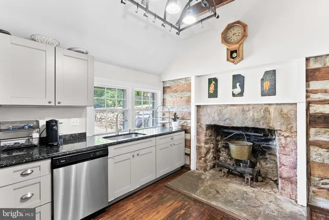 a kitchen with a stove and a fireplace