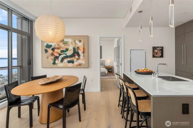 a view of a dining room with furniture and wooden floor