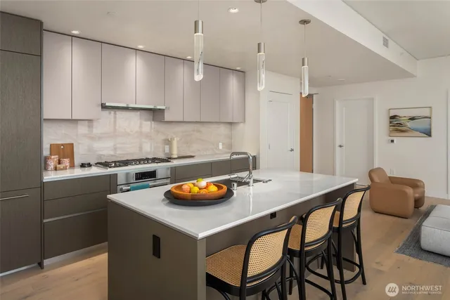 a kitchen with a table chairs and a sink