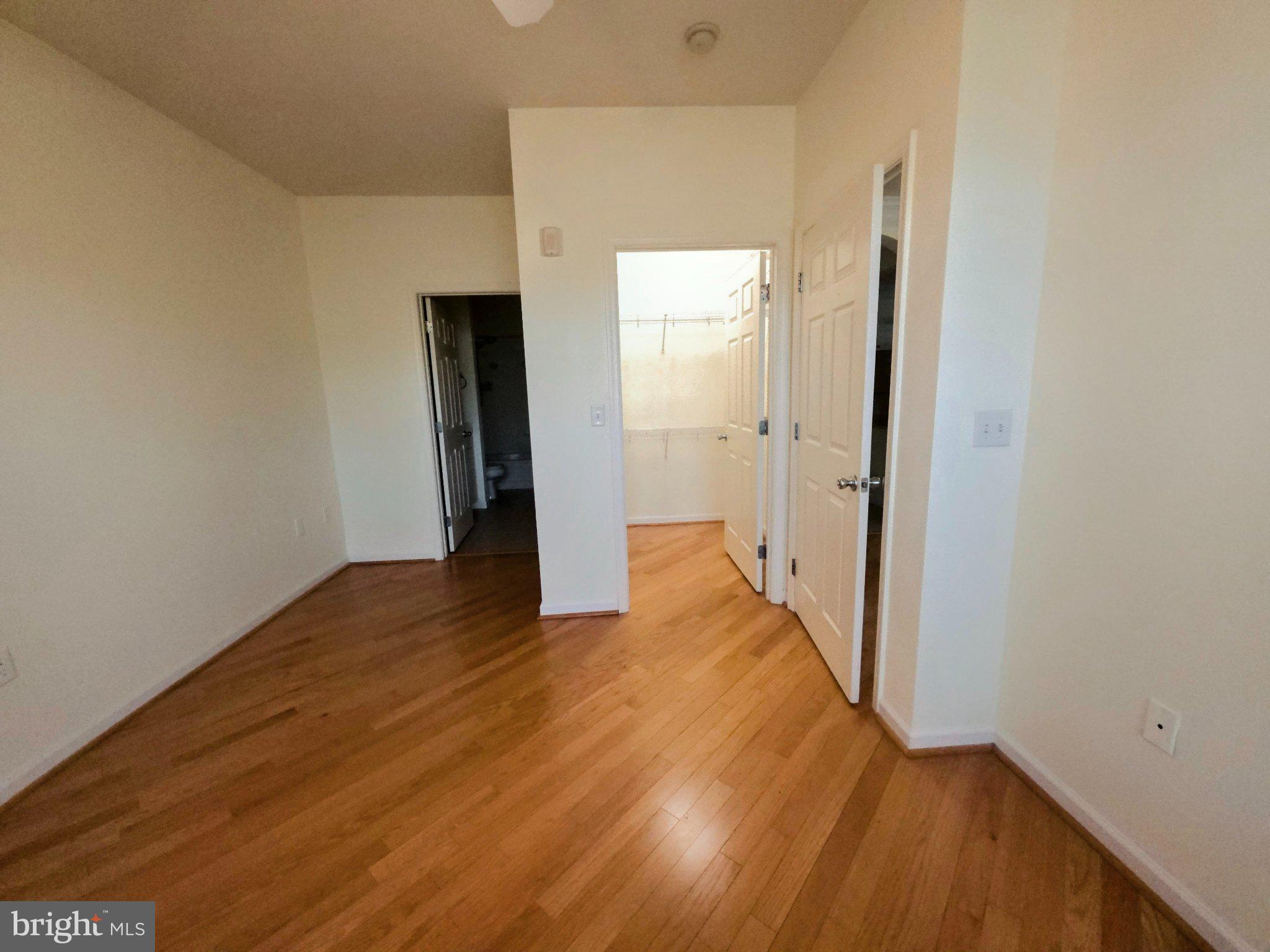 7 Booth Street, Unit 308 Gaithersburg, MD 20878 - Photo 11 of 21 a view of a hallway with wooden floor