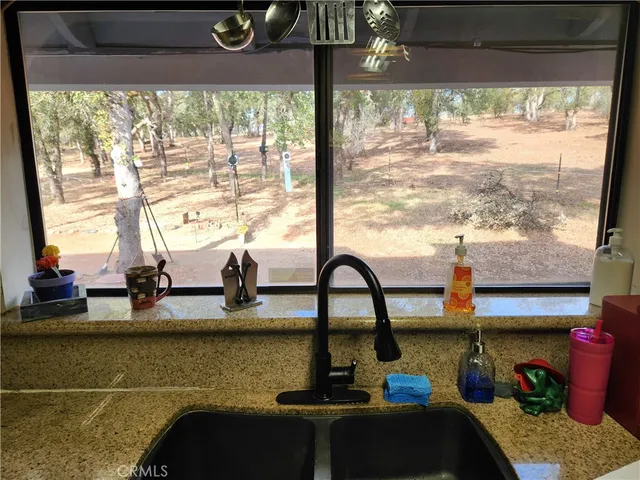 a view of a living room and floor to ceiling window