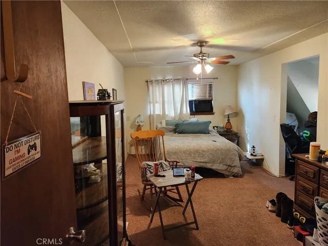 a room with furniture gym equipment and a window