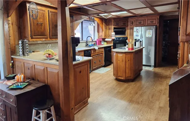 a kitchen with sink cabinets and window