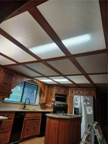 a kitchen with a stove and a microwave