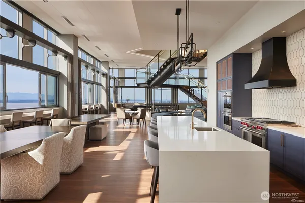 a living room with lots of furniture and a chandelier