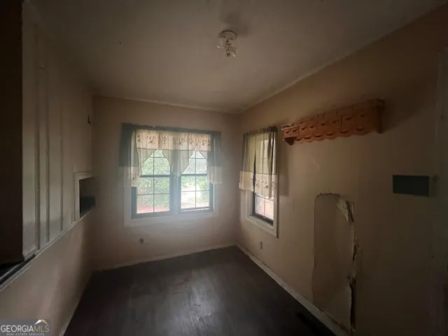 a view of an empty room and window