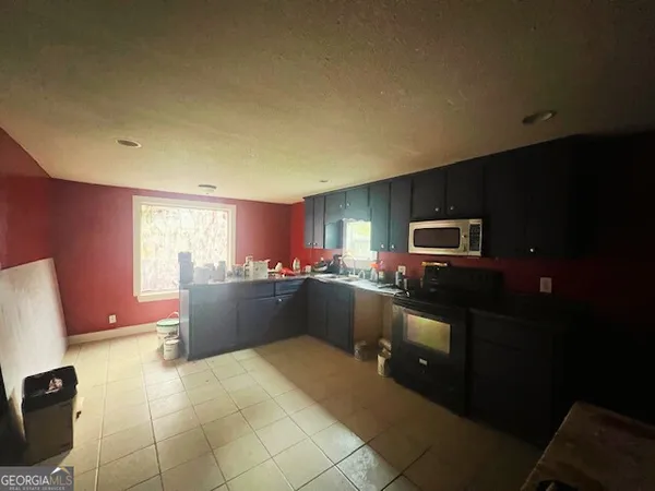 a kitchen with a sink and counter top space