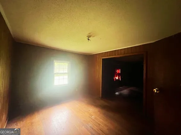 a view of a windows and yard in a room