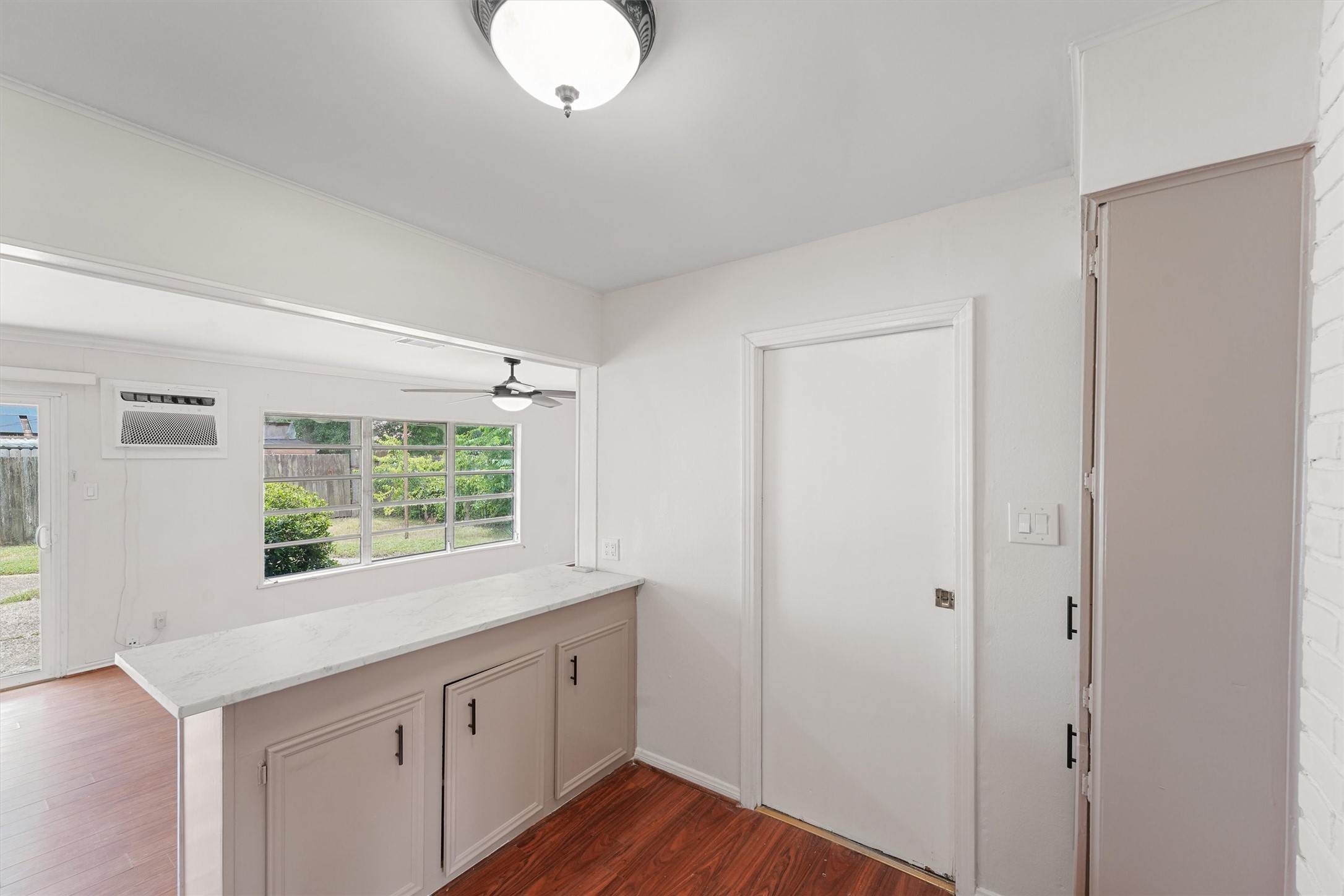 5826 Belmark Street Houston, TX 77033 - Photo 6 of 15 a kitchen with a window a sink and a window