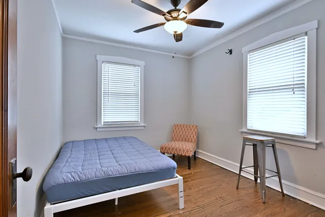 a room with chair and windows