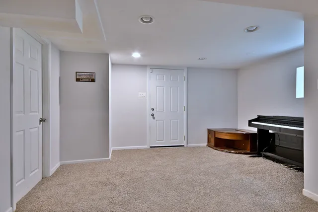 a view of a livingroom with furniture and front door