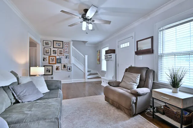 a living room with furniture and flat screen tv