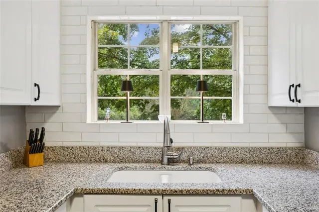 a kitchen with a sink and a window