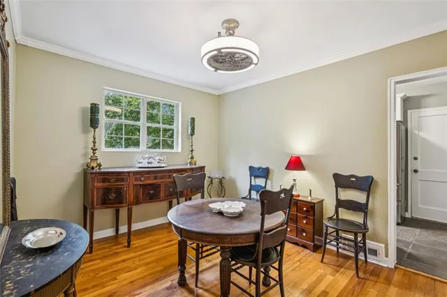 a view of a dining room with furniture and wooden floor