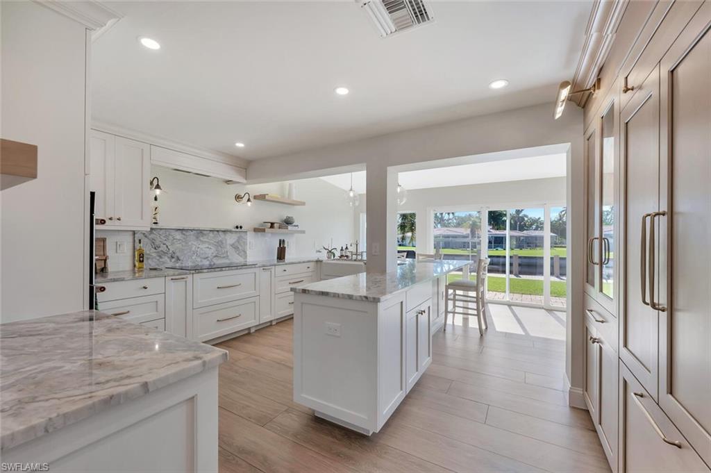 1925 Tarpon Road Naples, FL 34102 - Photo 17 of 41 a kitchen with counter top space and living room