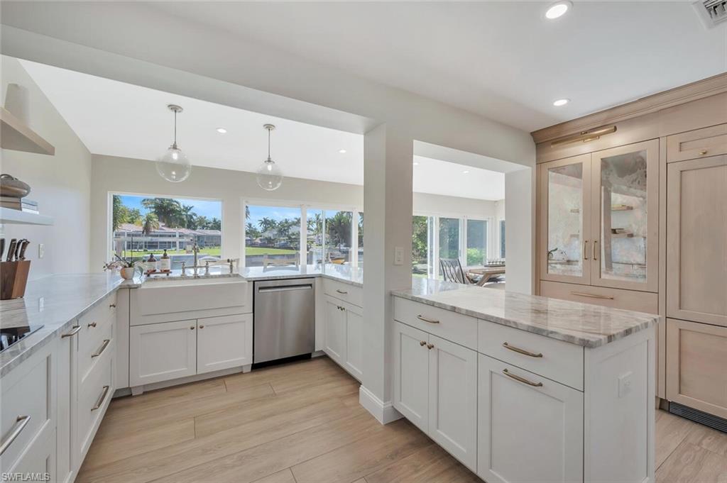 1925 Tarpon Road Naples, FL 34102 - Photo 18 of 41 a large white kitchen with a window