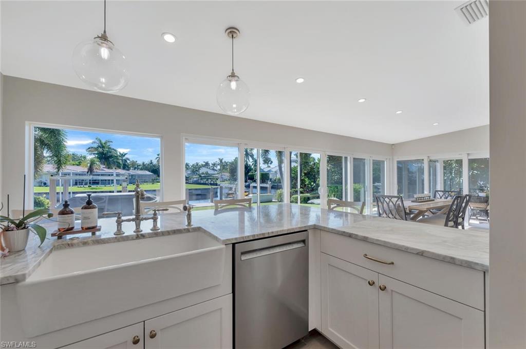 1925 Tarpon Road Naples, FL 34102 - Photo 20 of 41 a kitchen with sink attached with living room