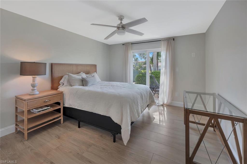 1925 Tarpon Road Naples, FL 34102 - Photo 31 of 41 a bedroom with a bed and a window