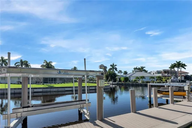 a view of a house with outdoor space and a lake view