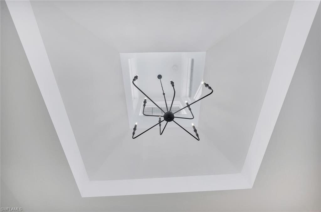 1925 Tarpon Road Naples, FL 34102 - Photo 7 of 41 a view of a hallway with a door