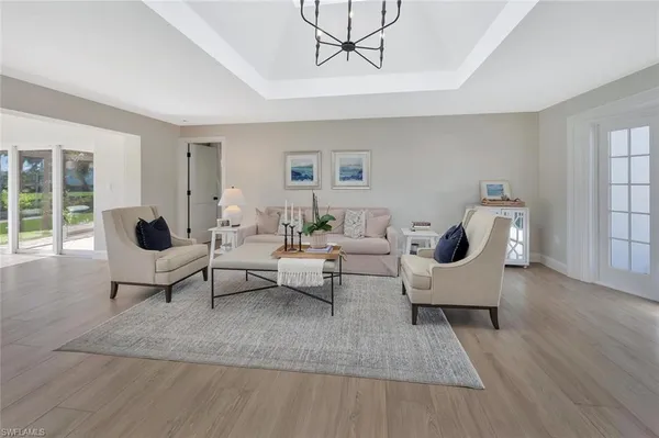 a living room with furniture rug and window