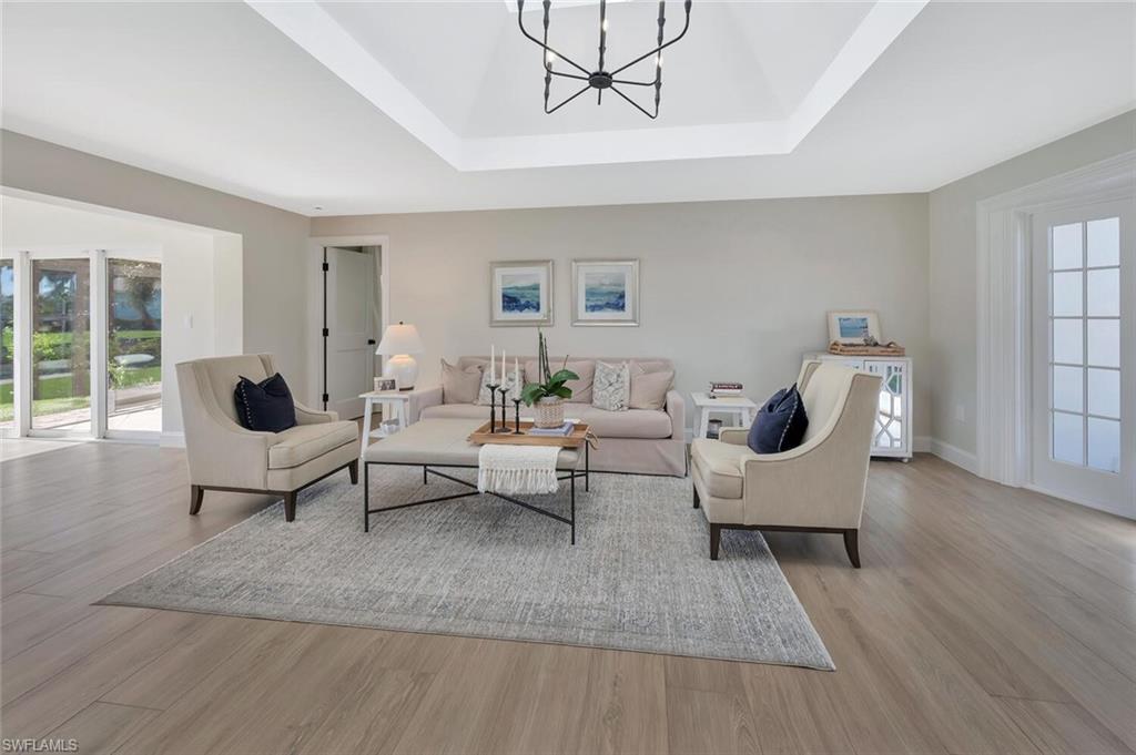 1925 Tarpon Road Naples, FL 34102 - Photo 9 of 41 a living room with furniture rug and window
