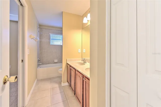 a bathroom with a tub and shower