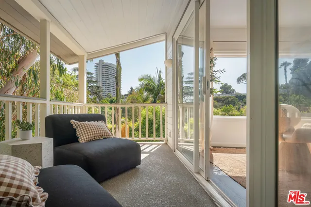 a kitchen with stainless steel appliances granite countertop a sink a stove and a wooden floors