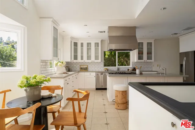 a bedroom with bed and a couch